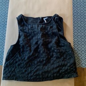 Black Elle sleeveless top. Black with grid pattern. Fits like a medium crop top